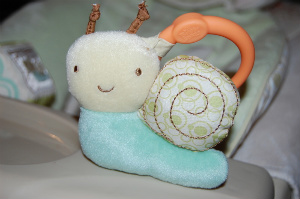 swing How cute is this? Two soft, plush toys attach to the tray with anchors. Genius!