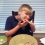 Here's my hungry son....aka "The Human Garbage Disposal" inhaling his delicious Domino's!
